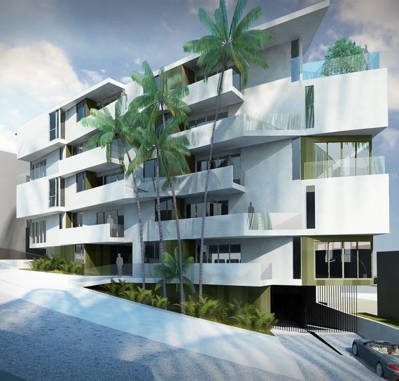 Modern white multi-story building with balconies and palm trees.