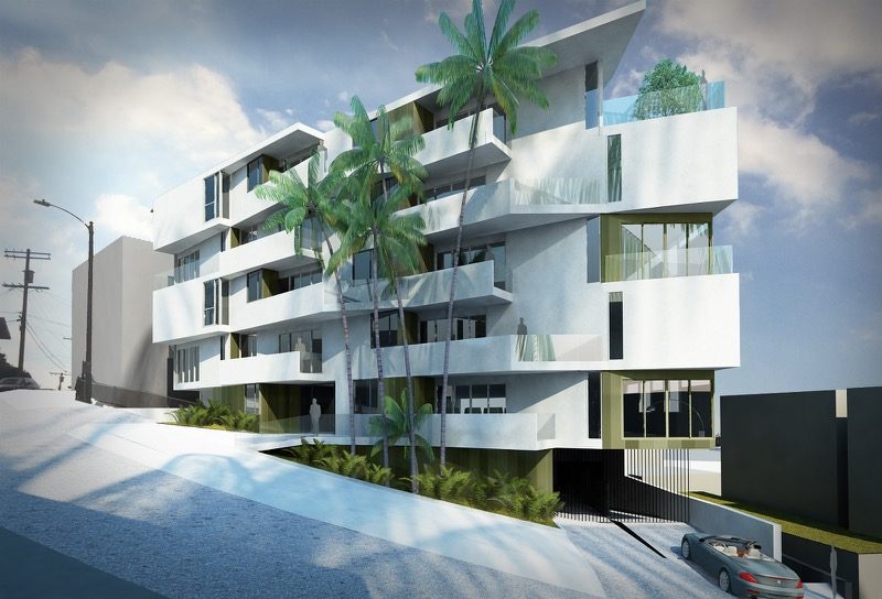 Modern white multi-story building with balconies and palm trees.