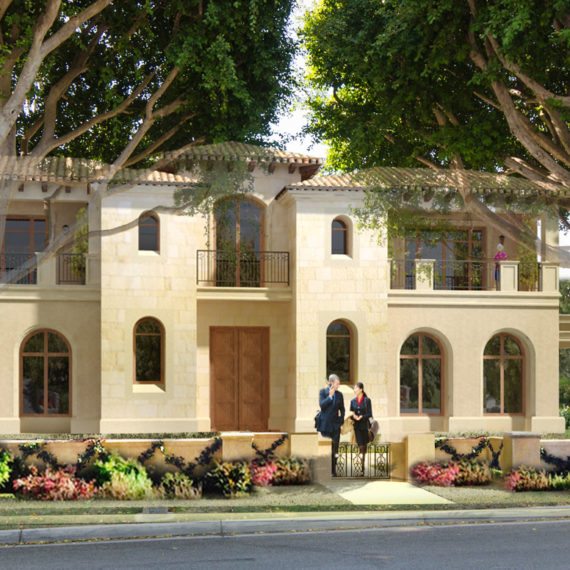 A two-story house with beige walls surrounded by trees and flowers.