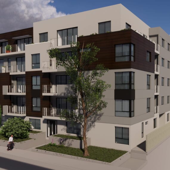 Modern multi-story apartment building with balconies and large windows.