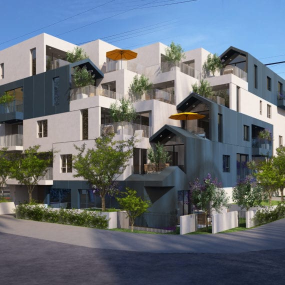 Modern apartment complex with terraces and greenery under a clear sky.