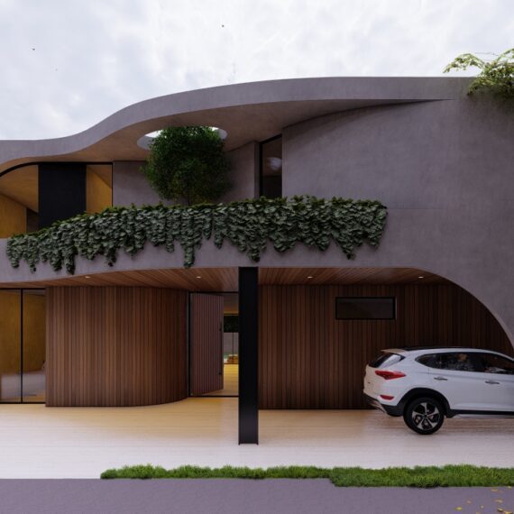 Modern house exterior with curved roof and greenery.